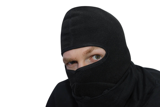 man in balaclava looks suspiciously close-up portrait isolated on a white background - Fotografie, Obrázek