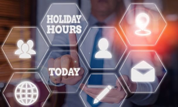 Handwriting text writing Holiday Hours. Concept meaning Overtime work on for employees under flexible work schedules. - Photo, Image