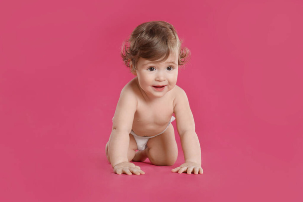 Cute little baby in diaper on pink background - Fotografie, Obrázek