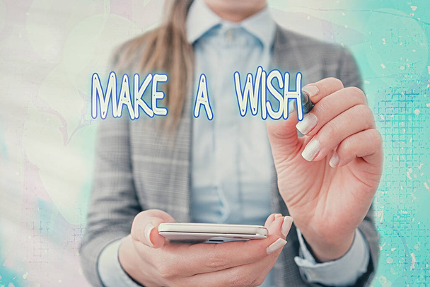 Teksten waarop Make A Wish staat. Conceptuele foto om te verlangen naar een situatie die verschilt van de situatie die bestaat. - Foto, afbeelding