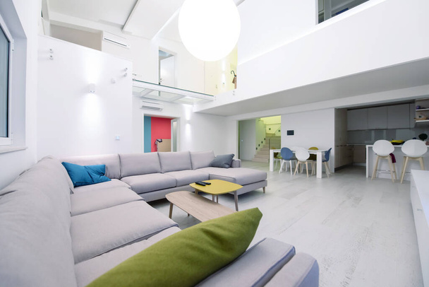 interior of a luxury stylish modern open space design two level apartment with white walls - Fotó, kép