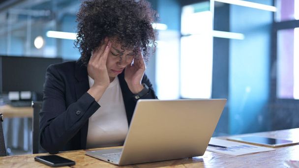 Tired African Businesswoman having Headache at Work - Fotó, kép