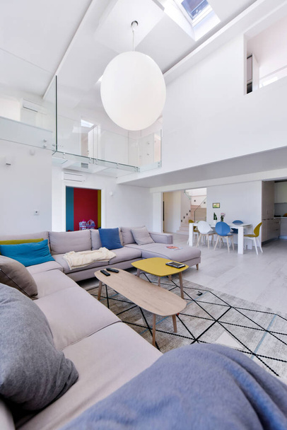interior of a luxury stylish modern open space design two level apartment with white walls - Fotó, kép