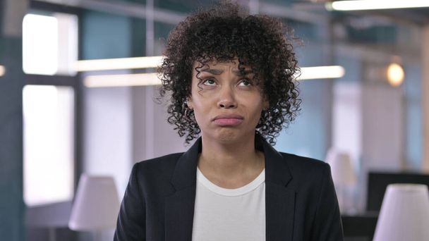 Portrait of Disappointed African Businesswoman Looking at the Camera and Frowning - Photo, Image