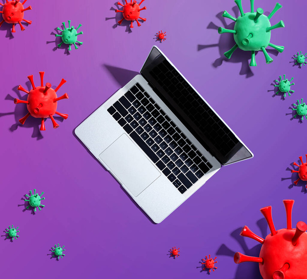 Laptop computer with epidemic influenza concept - 写真・画像