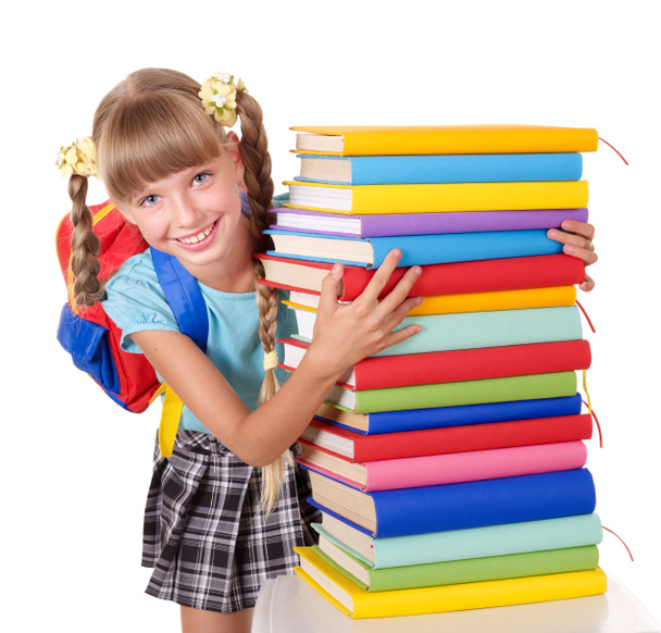 Schoolgirl holding pile of books. - Photo, Image