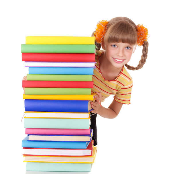 Schoolgirl holding pile of books. - Fotoğraf, Görsel