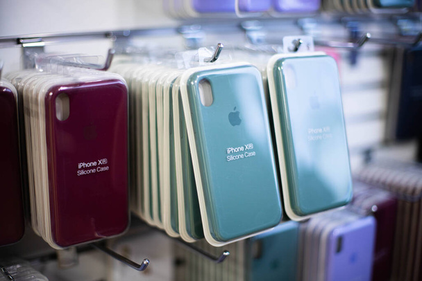 Original cases for iPhone. Colorful Phone Cases For Sale In Mobile Phones Stores. iPhone's case in the package. Apple accessories. Apple iPhone colorful soft touch cases. Kiev, Ukraine 03.03.2020 - 写真・画像