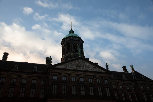 A low angle shot of the Royal Palace at the Dam Square in Amsterdam, Netherlands - Foto, afbeelding