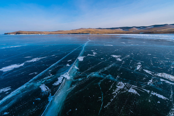 Baikal lake in winter season with cracks on ice floor, Siberia, Russia, Asia - Photo, image