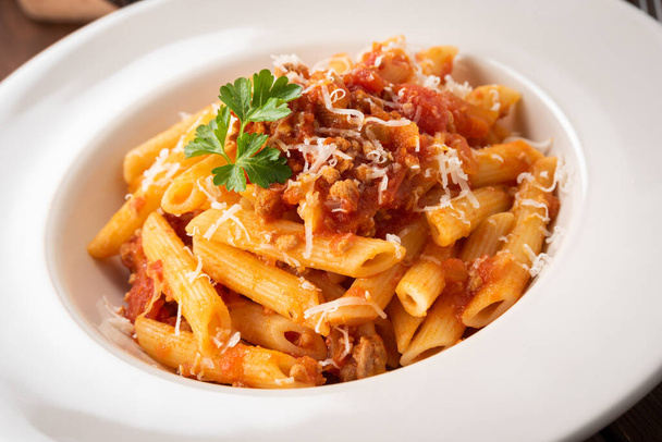 Dish of delicious pasta with bolognese sauce, Italian Cuisine  - Foto, Bild