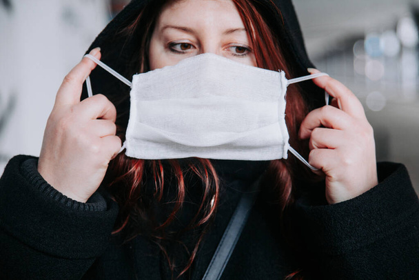 COVID-19 Pandemic Coronavirus .Woman wearing face mask because virus epidemic in the city - Zdjęcie, obraz