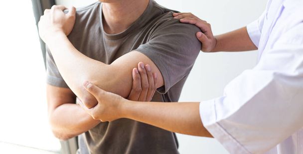 Professional therapists are stretching muscles, patients with abnormal muscular symptoms, physical rehabilitation therapies and treatment of physiological disorders by physiotherapists concept. - Photo, image