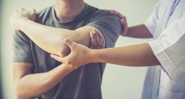 Professional therapists are stretching muscles, patients with abnormal muscular symptoms, physical rehabilitation therapies and treatment of physiological disorders by physiotherapists concept. - Foto, afbeelding