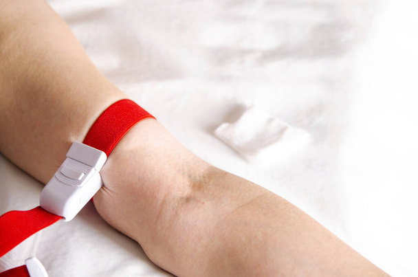 Woman's vein ready for intravenous injection during pandemic - Photo, Image