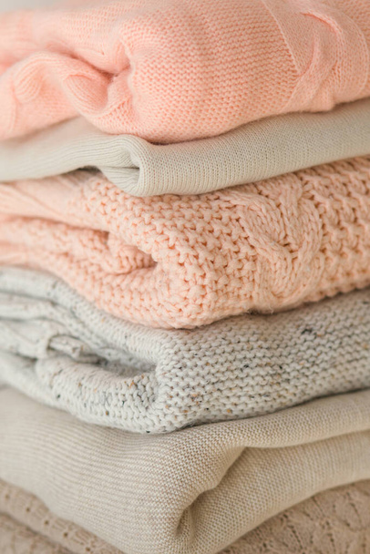 pile of warm sweaters on background - Photo, Image