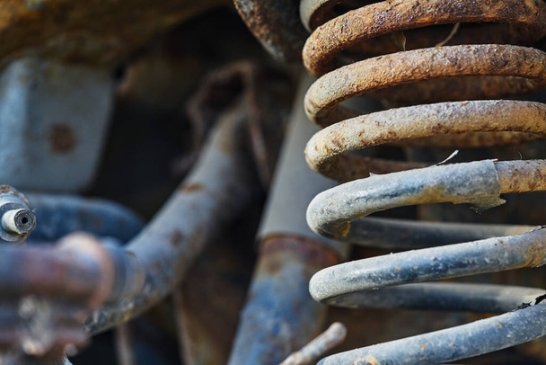 Rusty shock absorber on disassembled car. - Foto, Bild