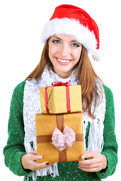 Beautiful smiling girl in New Year hat with gifts isolated on white - Foto, Imagen