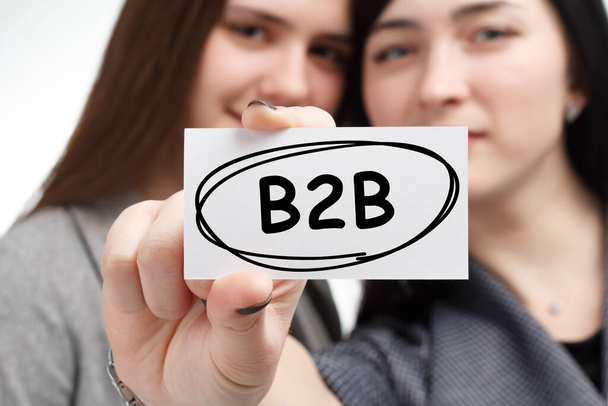 Business, technology, internet and network concept. Young businessman shows a keyword: B2B - Foto, immagini