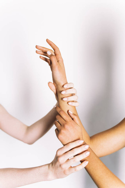 multiracial hands holding on white background  - Photo, Image