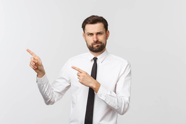 Bearded serious businessman pointing finger at you. Isolated on grey studio background - Foto, immagini