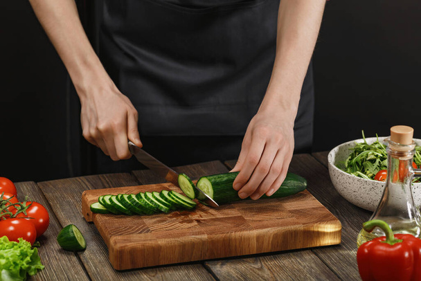 Woman cooking fresh vegetable salad. Female hands. Diet concept for healthy lifestyle. - Fotó, kép