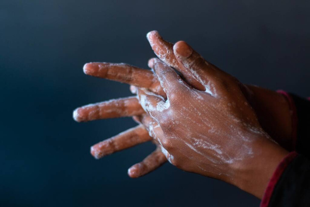 A closeup shot of the soaped hands of a person - importance of washing hands during the coronavirus pandemic - Foto, Imagem