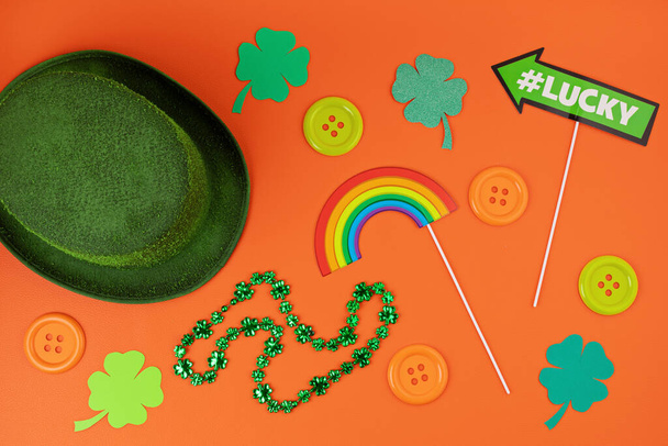 Top view over Saint Patrick day symbols in traditional colors. Greeting card, invitation, celebration idea - Photo, Image