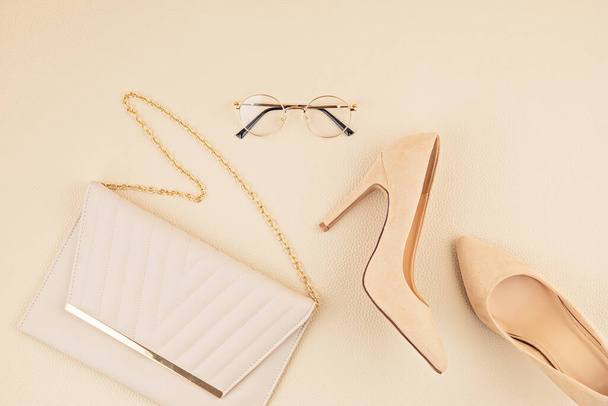 Flat lay with woman fashion accessories in beige colors. Fashion blog, summer style, shopping and trends concept - Photo, Image