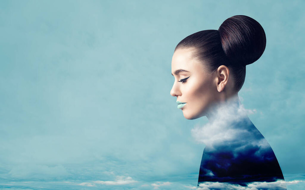 Fine art portrait of perfect woman with blue clouds and sky - Photo, Image