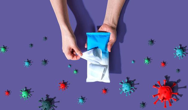 Sanitizer wipe with coronavirus concept - Foto, immagini
