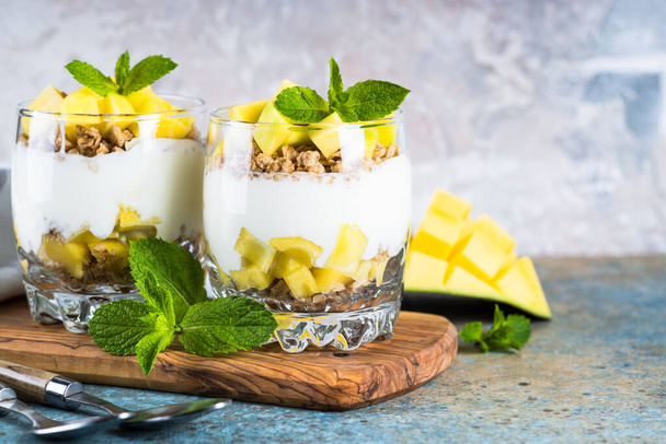 Parfait with yogurt, mango and granola. - Photo, Image