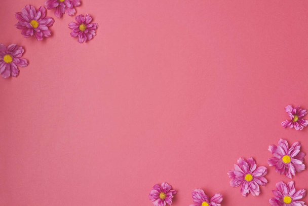 Flower composition on pink background. Copy space. - Фото, изображение