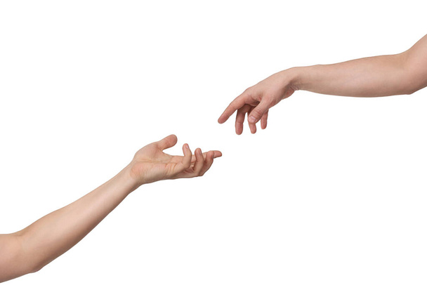A felülről kinyújtott kéz engedékenységet mutat a másik kéznek. Elkülönítve fehér háttérrel és másolótérrel - Fotó, kép