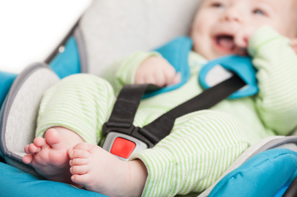 Little baby child in safety car seat - Foto, imagen