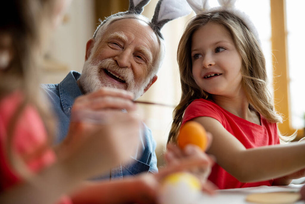 Laughing grandfather with smiling girl stock photo - Photo, image