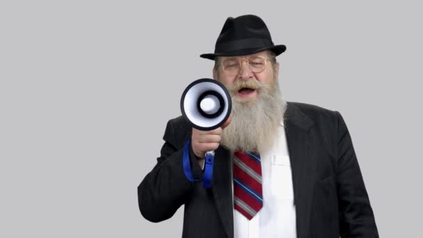Old company leader speaks in megaphone loudly. - Footage, Video