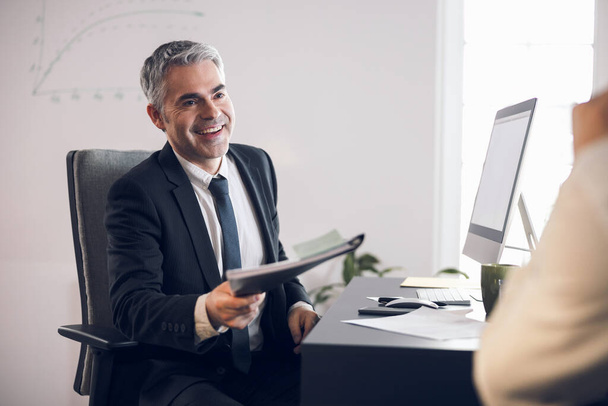 Mature happy man in suit working in office - Фото, изображение
