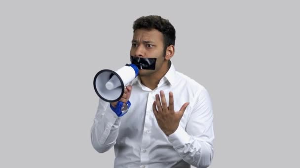 Young censored man with loudspeaker. - Záběry, video