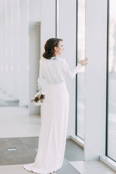  Stylish European wedding. Modern trends in the image of the bride. Bright portrait of the bride in the Museum. - Фото, изображение