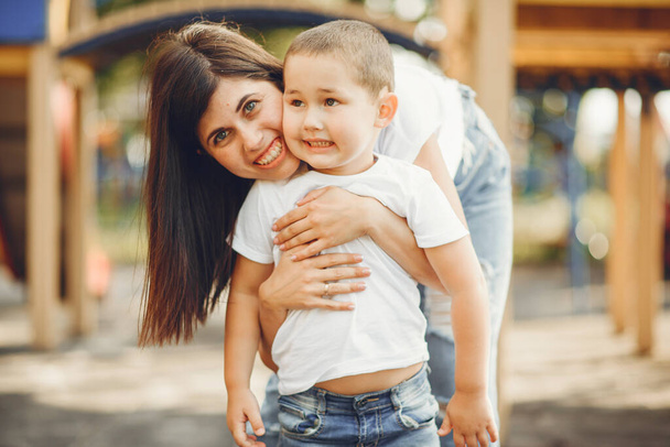 Mother with little child on a playground - Φωτογραφία, εικόνα
