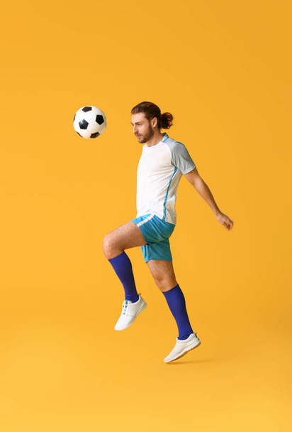 Male football player on color background - Foto, immagini