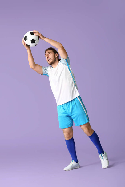 Football goal-keeper on color background - Fotoğraf, Görsel