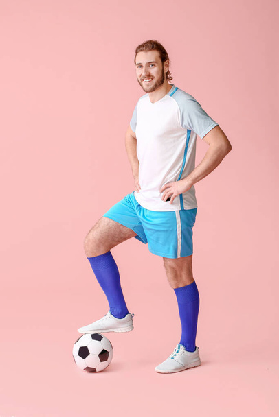Male football player on color background - Photo, Image