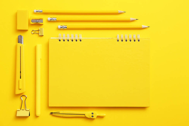 Notebook with school supplies on color background - Photo, Image