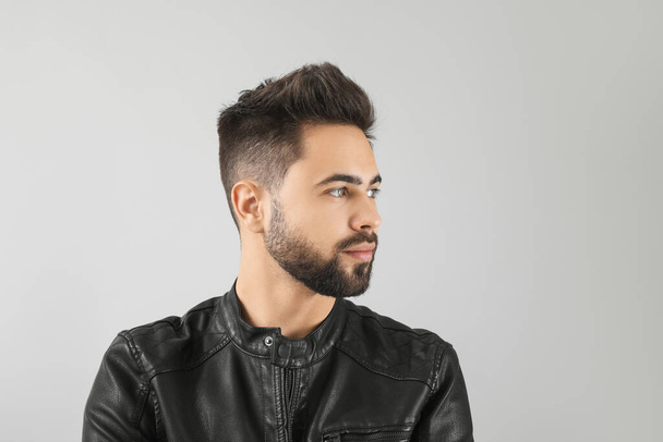 Handsome man with healthy hair on light background - Photo, Image