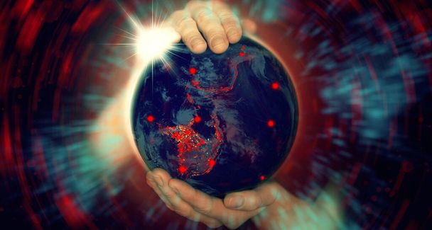 Female hands hold the globe with epicenters of infection Covid 19 with a bright red and blue halo. Concept - Photo, Image