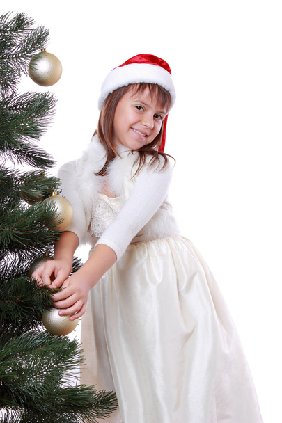 Pretty girl in santa hat - Фото, зображення