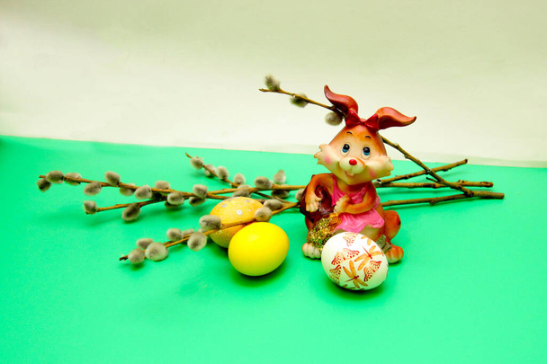 Easter composition with eggs, willow , candle and rabbit - Φωτογραφία, εικόνα