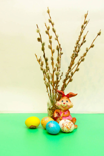 Easter composition with eggs, willow , candle and rabbit - Φωτογραφία, εικόνα